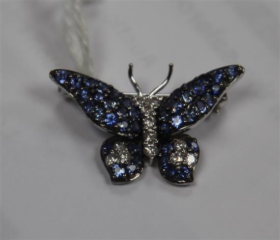 A modern 18ct white gold, sapphire and diamond set butterfly brooch, diameter 26mm.